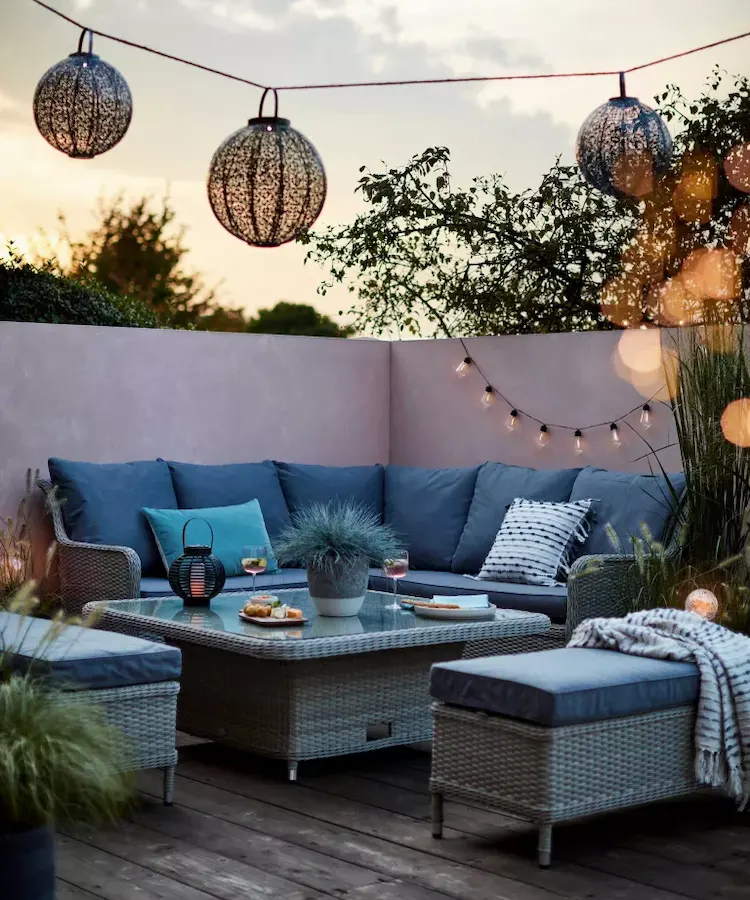 Make a patio cozy for fall and winter with rustic lighting like chain lights